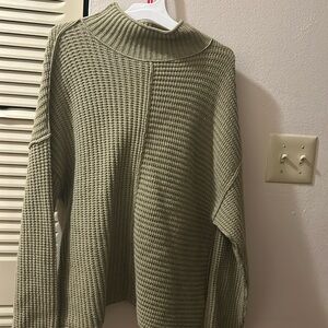 Green turtleneck sweater